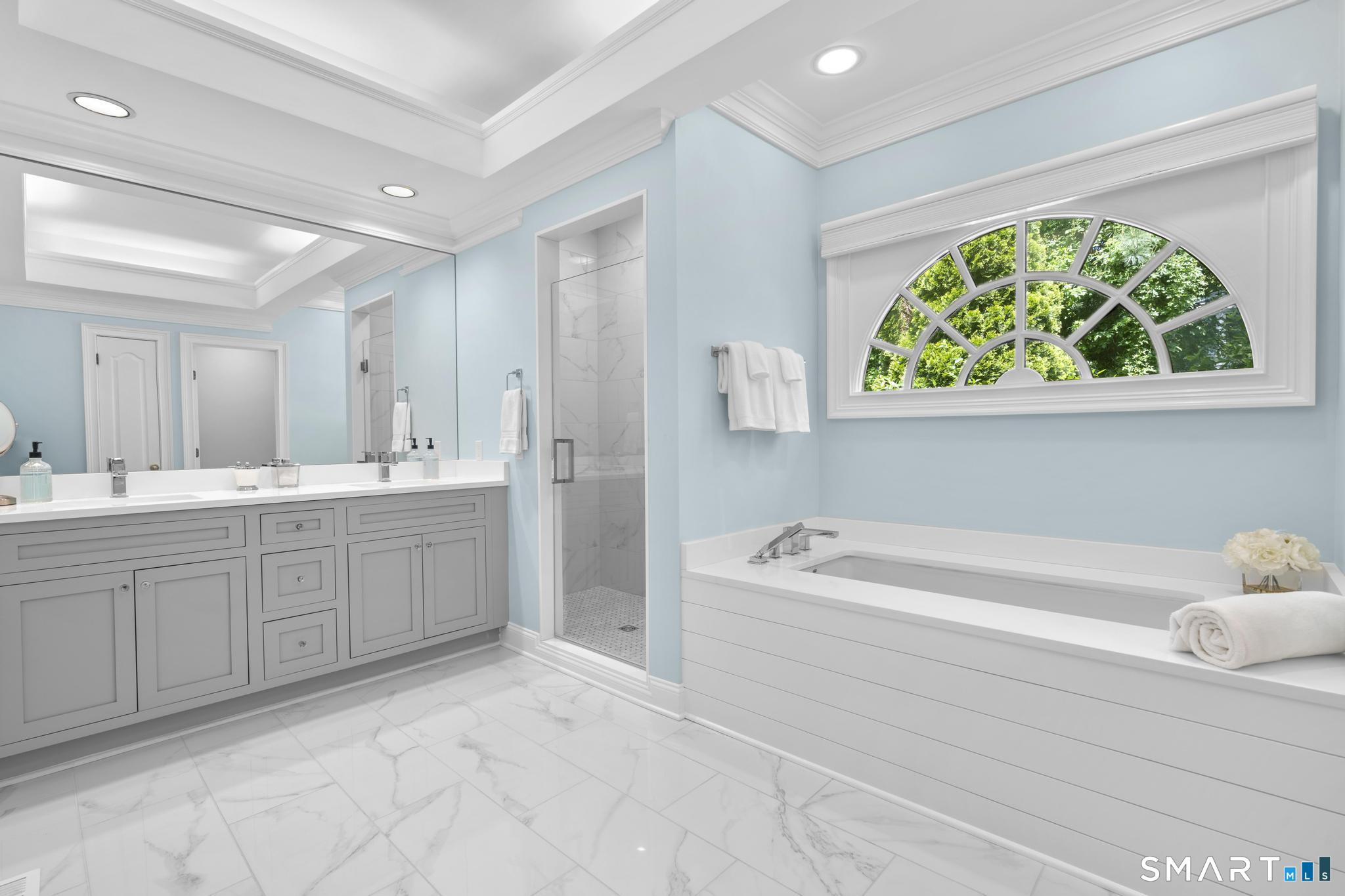 130 Stillson Road, Unit 130 Fairfield, CT 06825 - Photo 17 of 38 Updated spa-like primary ensuite bathroom with double vanity, stall shower, soaking tub, water closet, and linen closet