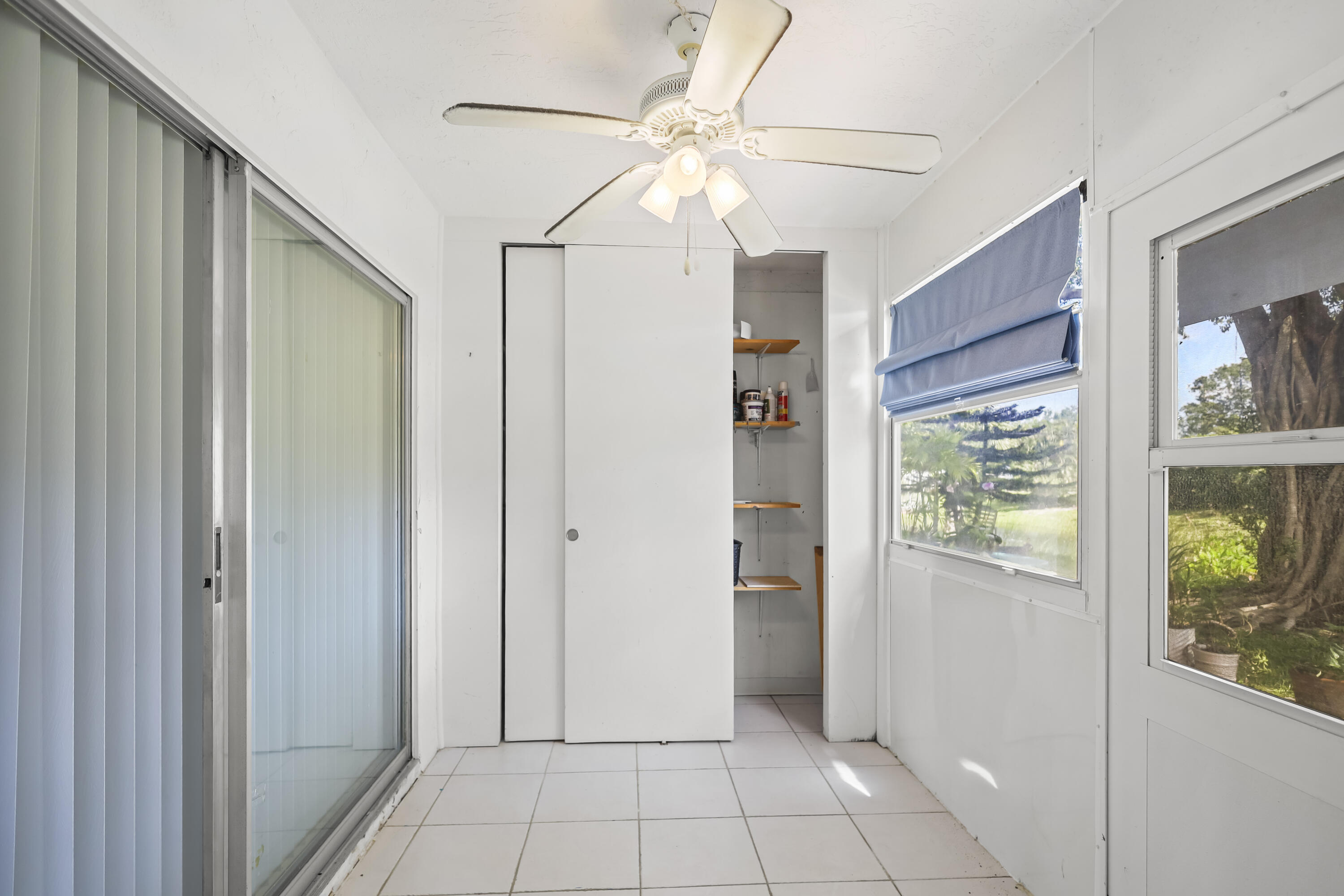 2500 Fiore Way, Unit 103 Delray Beach, FL 33445 - Photo 16 of 19 a view of an entryway with a window