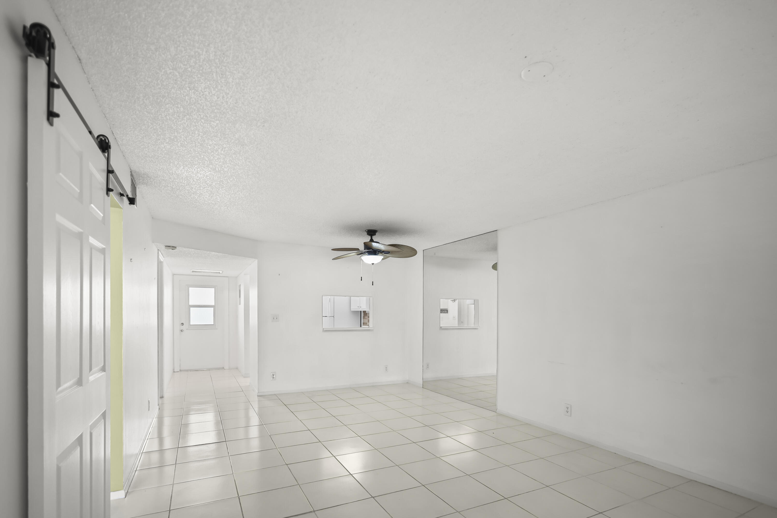 2500 Fiore Way, Unit 103 Delray Beach, FL 33445 - Photo 4 of 19 a view of an empty room