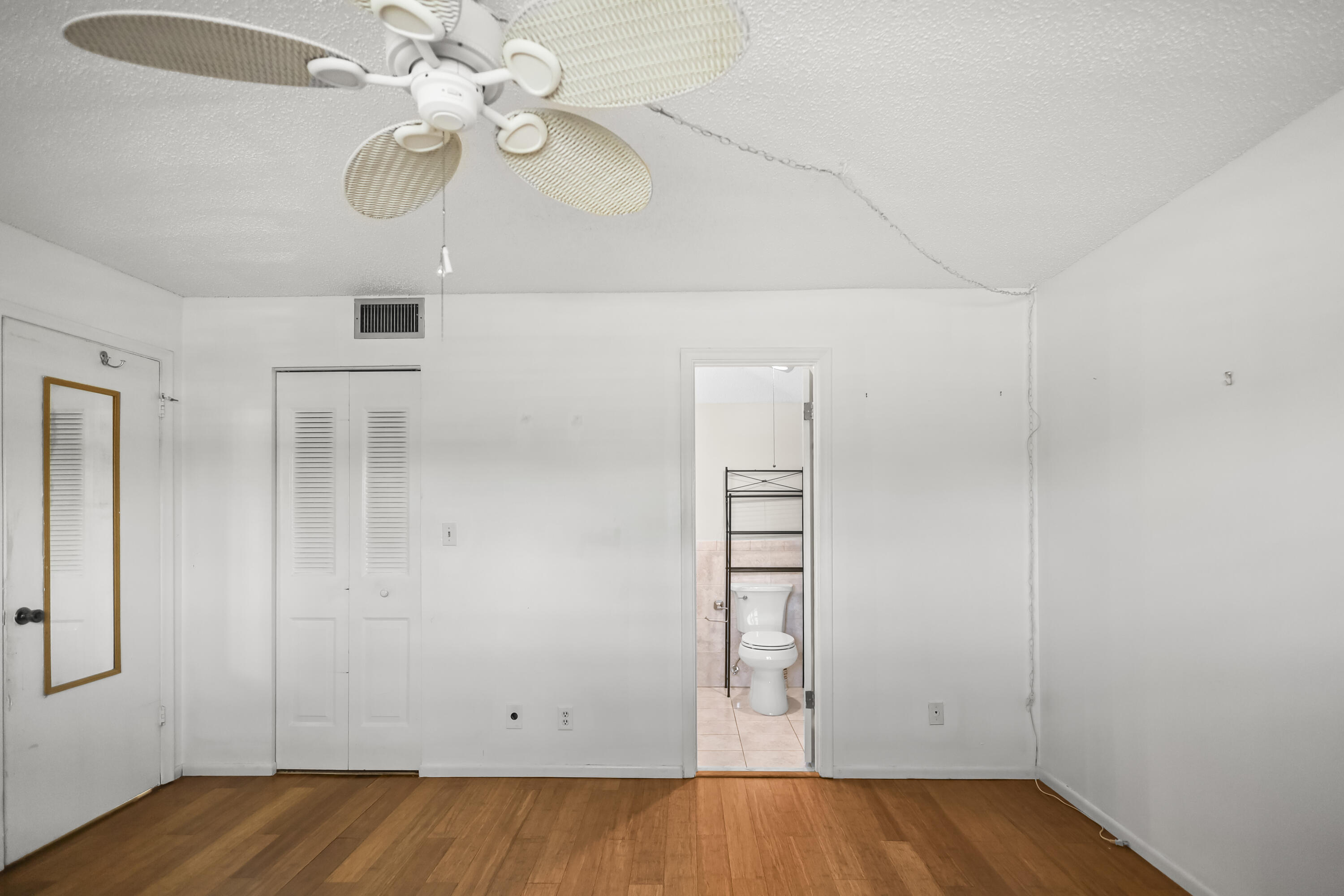 2500 Fiore Way, Unit 103 Delray Beach, FL 33445 - Photo 8 of 19 wooden floor in an empty room