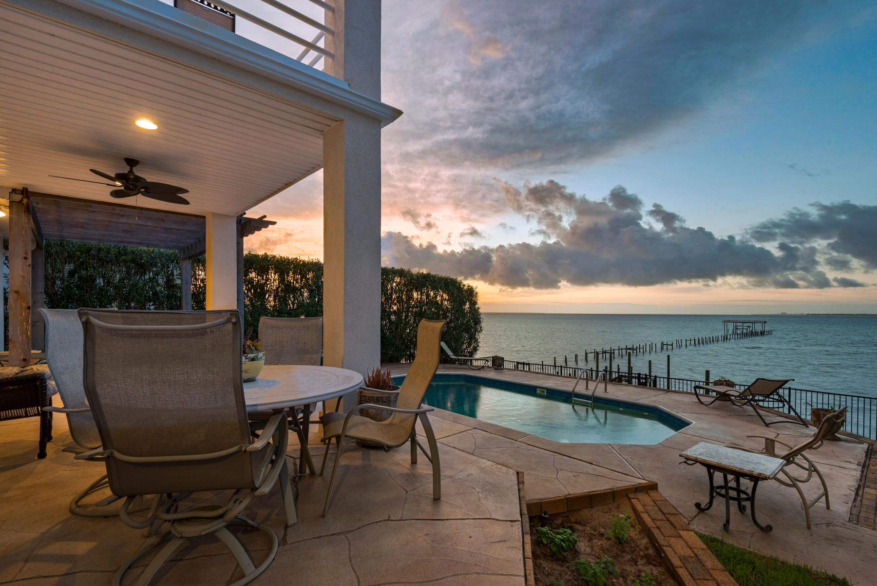 311 Country Club Road Shalimar, FL 32579 - Photo 1 of 73 a view of a chairs and table in patio