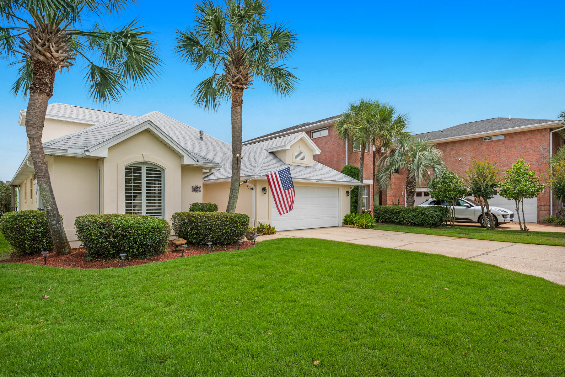 311 Country Club Road Shalimar, FL 32579 - Photo 17 of 73 a front view of a house with a yard and garage