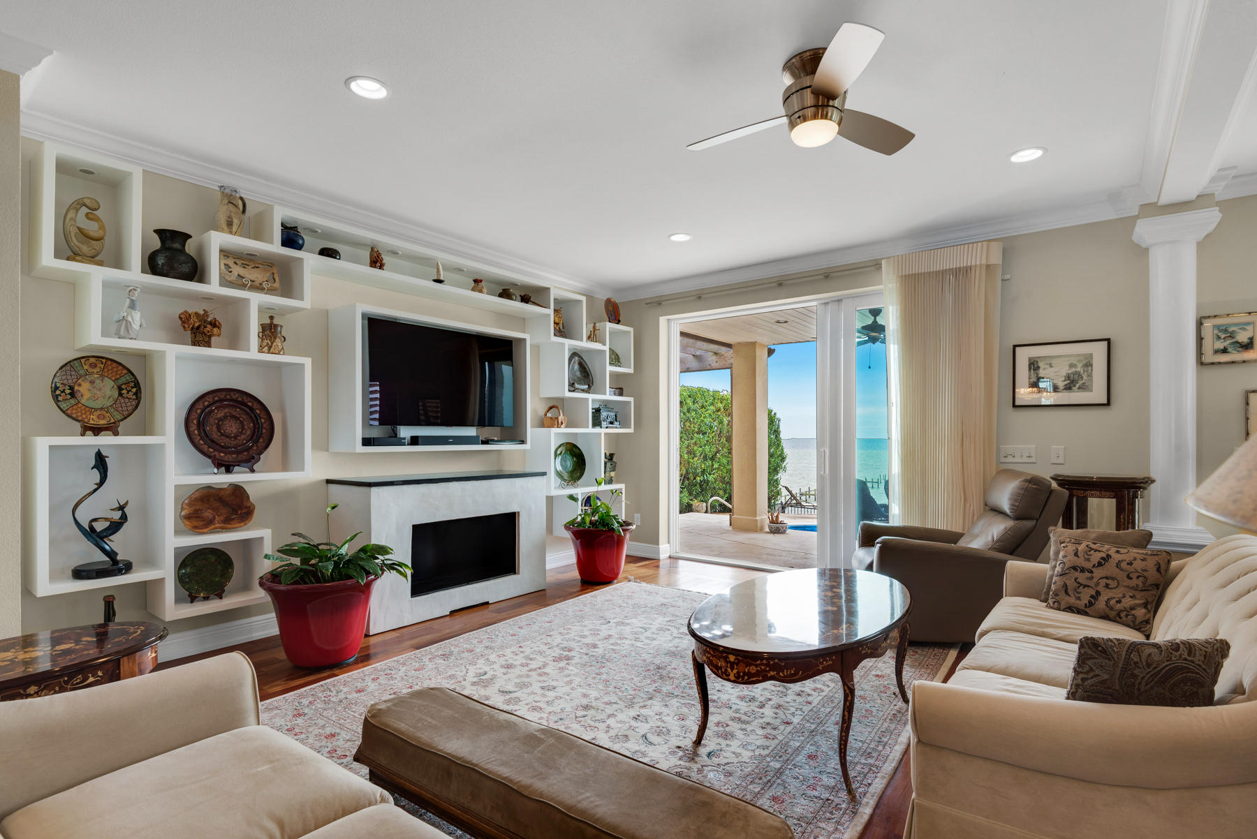 311 Country Club Road Shalimar, FL 32579 - Photo 27 of 73 a living room with furniture a fireplace and a flat screen tv