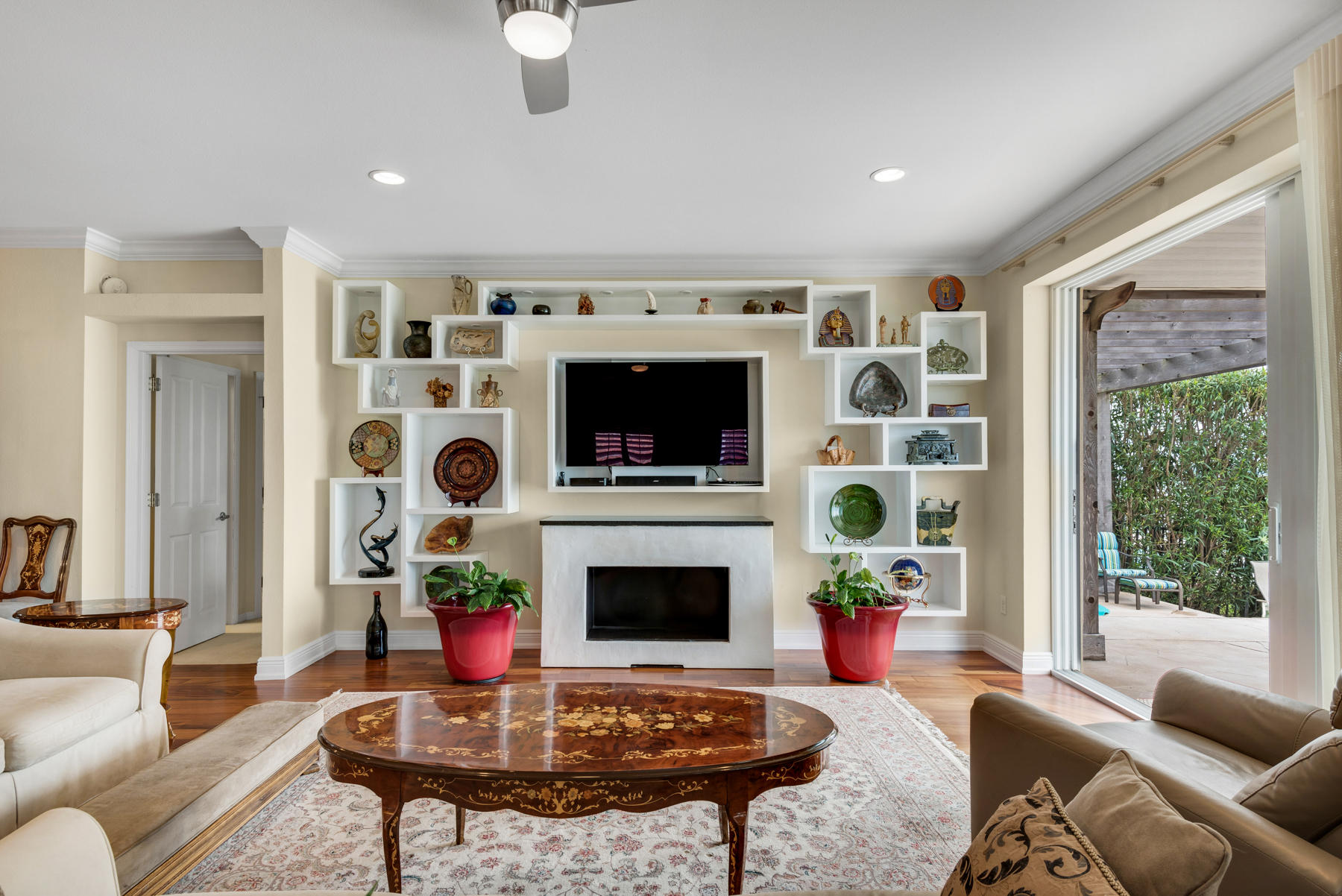 311 Country Club Road Shalimar, FL 32579 - Photo 28 of 73 a living room with furniture a flat screen tv and a fireplace