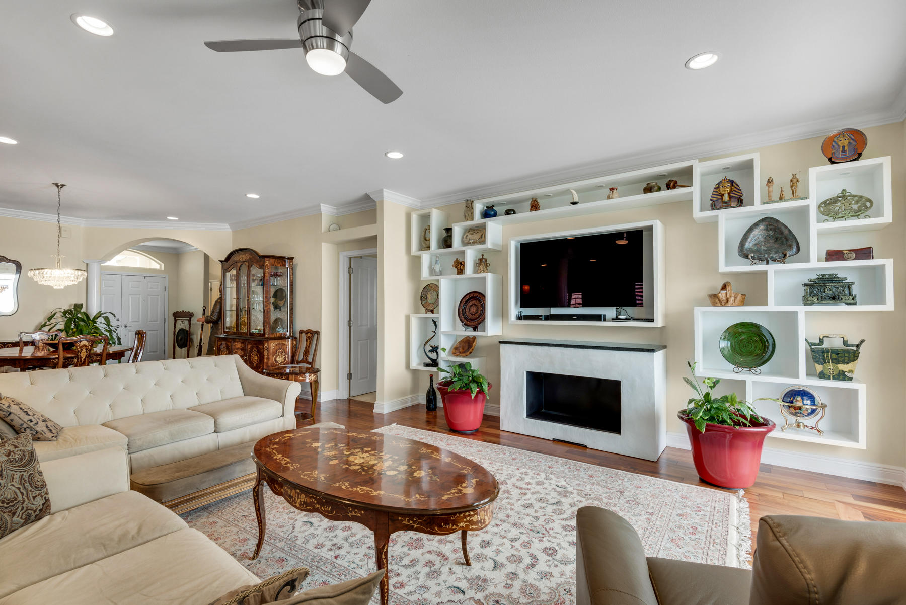 311 Country Club Road Shalimar, FL 32579 - Photo 29 of 73 a living room with furniture a flat screen tv and a fireplace