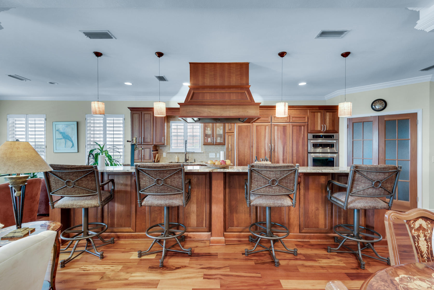 311 Country Club Road Shalimar, FL 32579 - Photo 33 of 73 a open kitchen with stainless steel appliances kitchen island granite countertop a table and chairs in it
