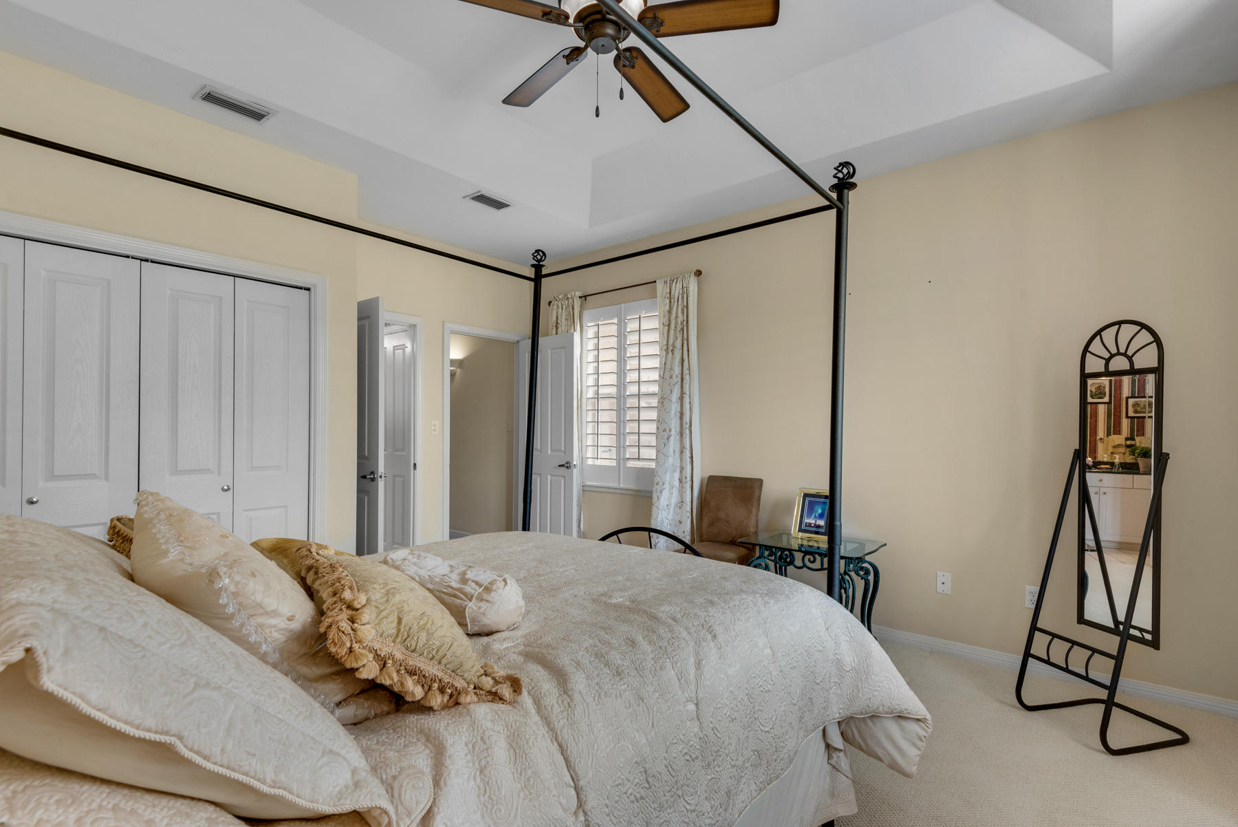 311 Country Club Road Shalimar, FL 32579 - Photo 42 of 73 a bedroom with a bed and a chandelier