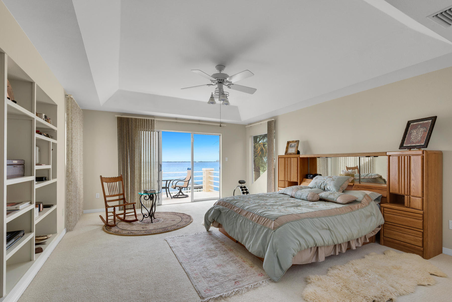 311 Country Club Road Shalimar, FL 32579 - Photo 45 of 73 a bedroom with a bed a couch and a chandelier