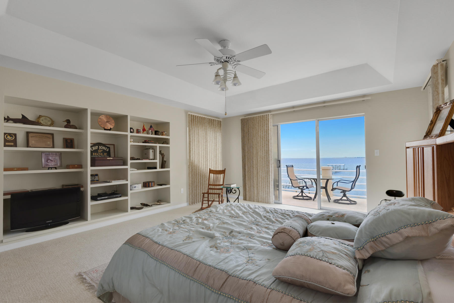 311 Country Club Road Shalimar, FL 32579 - Photo 46 of 73 a spacious bedroom with a bed a couch and cabinet