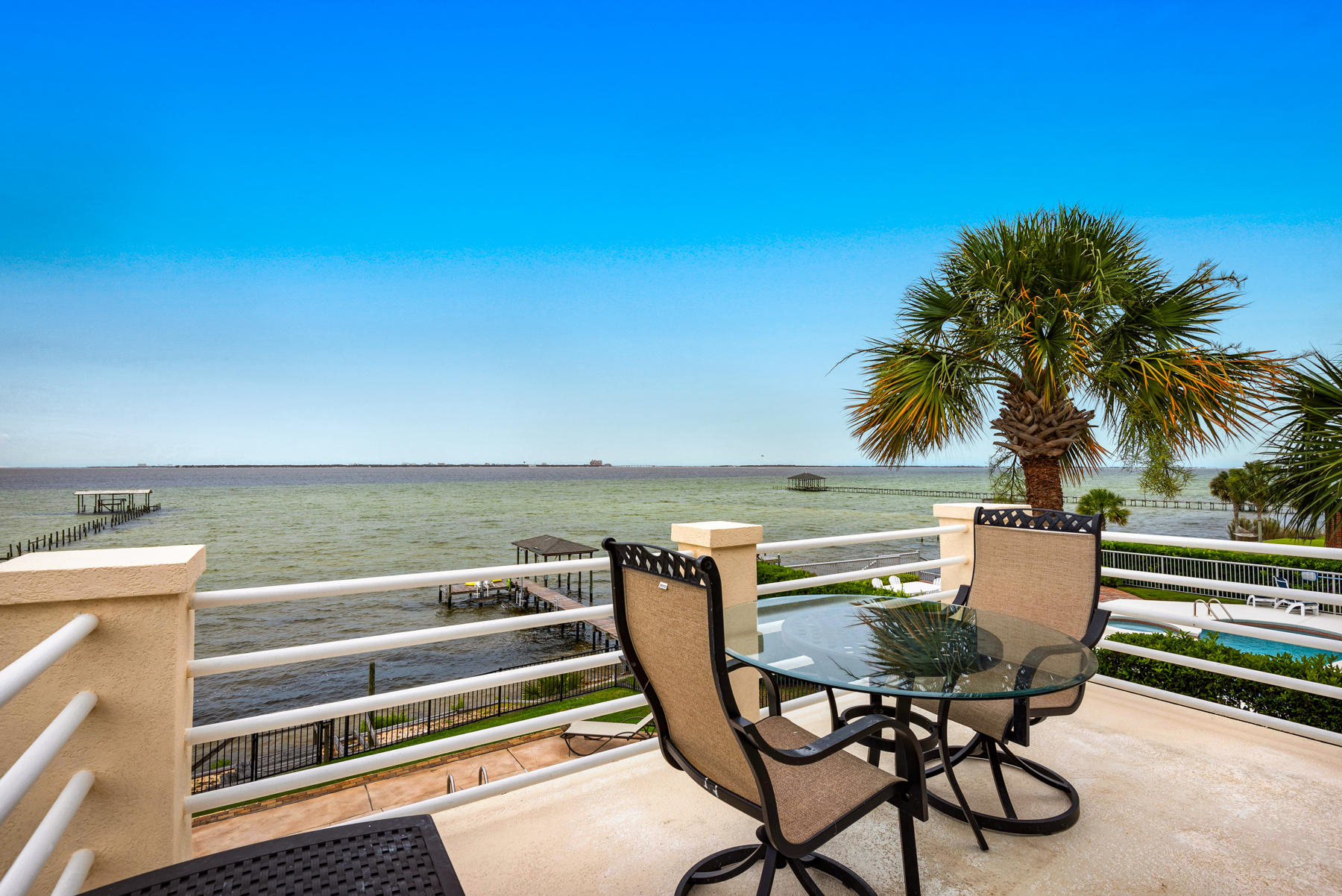 311 Country Club Road Shalimar, FL 32579 - Photo 49 of 73 a view of a chairs and table in patio