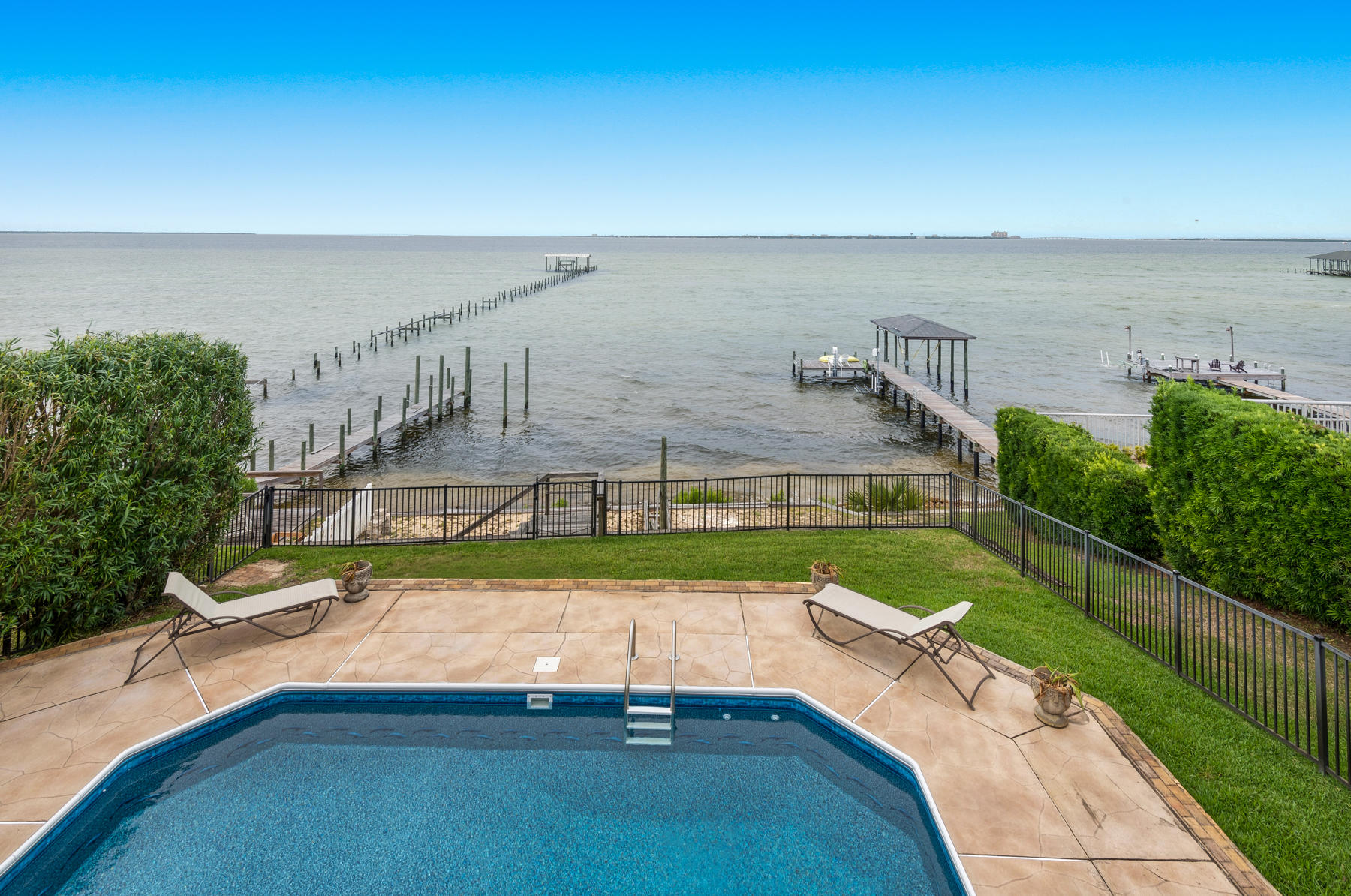 311 Country Club Road Shalimar, FL 32579 - Photo 51 of 73 a view of a swimming pool with an outdoor space and seating area