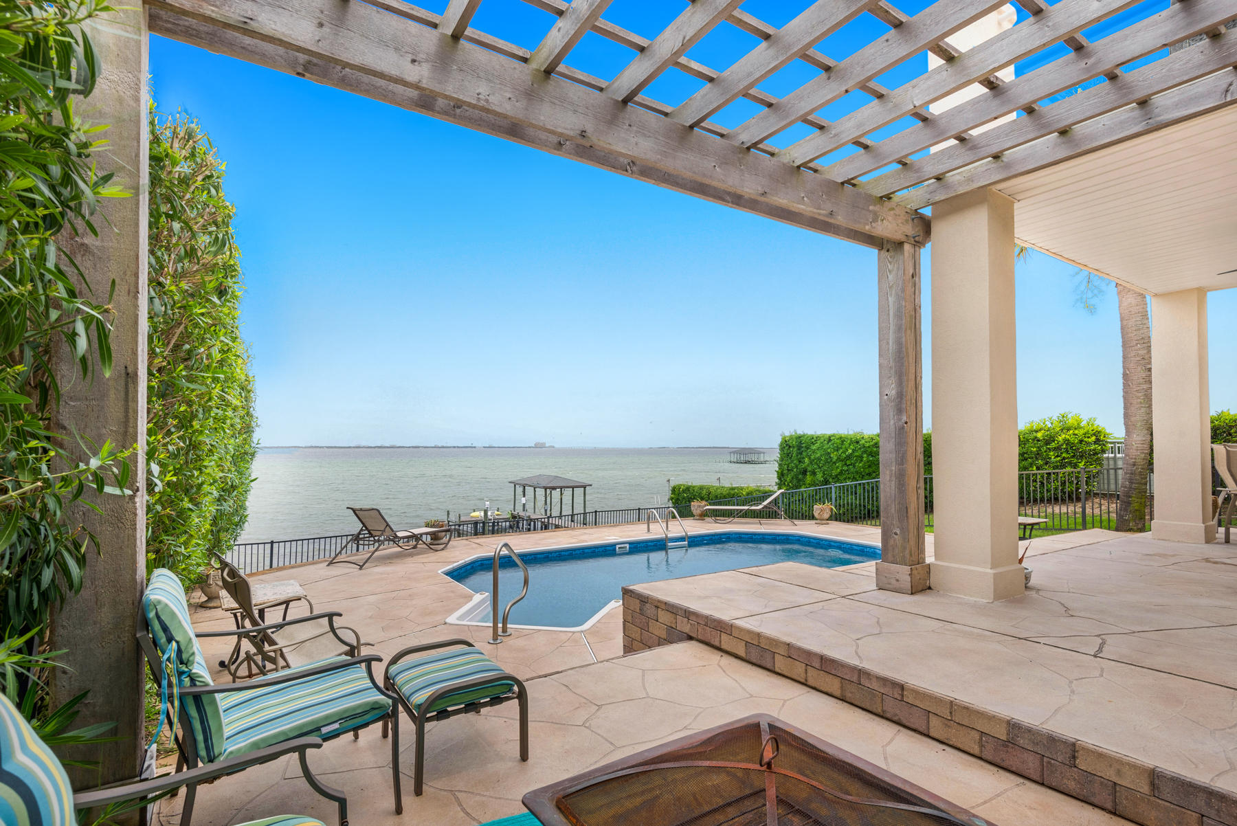 311 Country Club Road Shalimar, FL 32579 - Photo 59 of 73 a view of swimming pool with outdoor seating and plants
