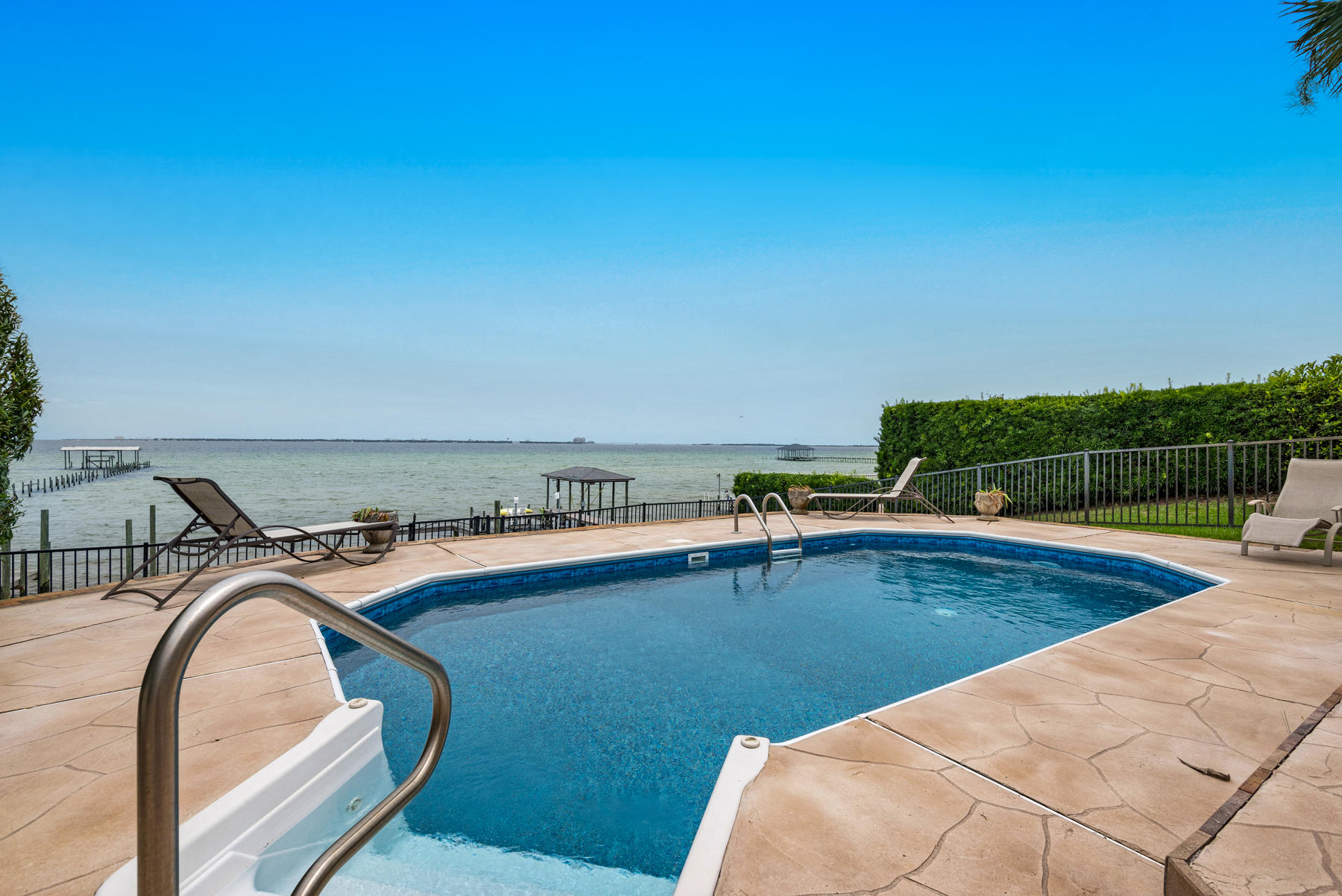 311 Country Club Road Shalimar, FL 32579 - Photo 63 of 73 a view of a swimming pool with a lounge chair