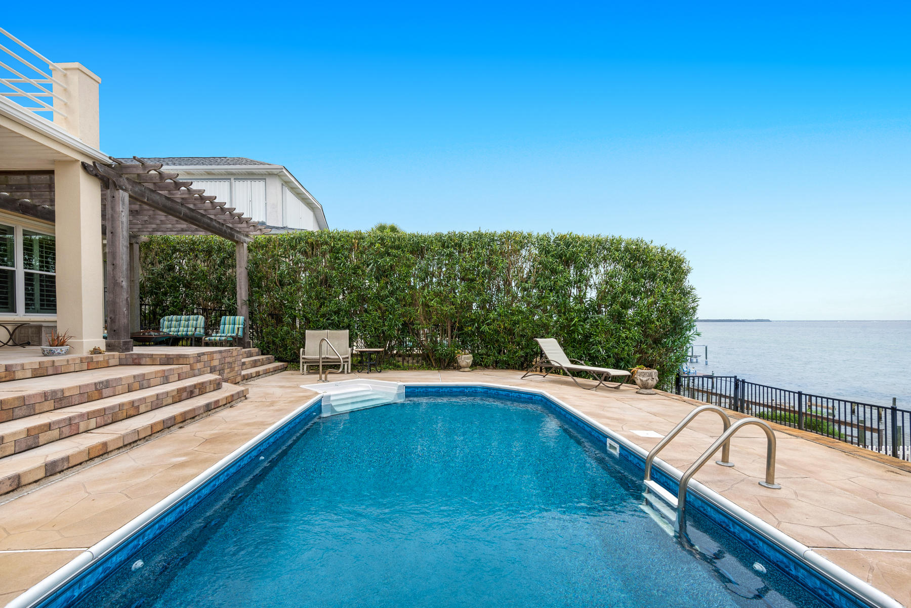 311 Country Club Road Shalimar, FL 32579 - Photo 65 of 73 a view of a swimming pool with a patio