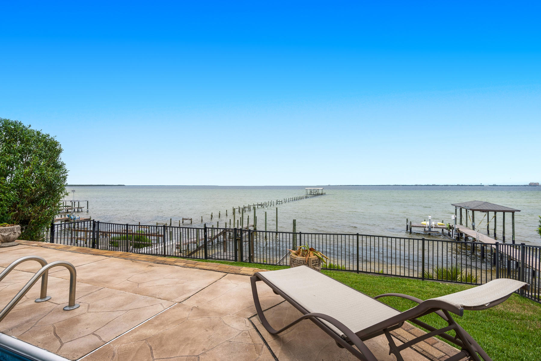 311 Country Club Road Shalimar, FL 32579 - Photo 66 of 73 a view of a balcony with two chairs and a table