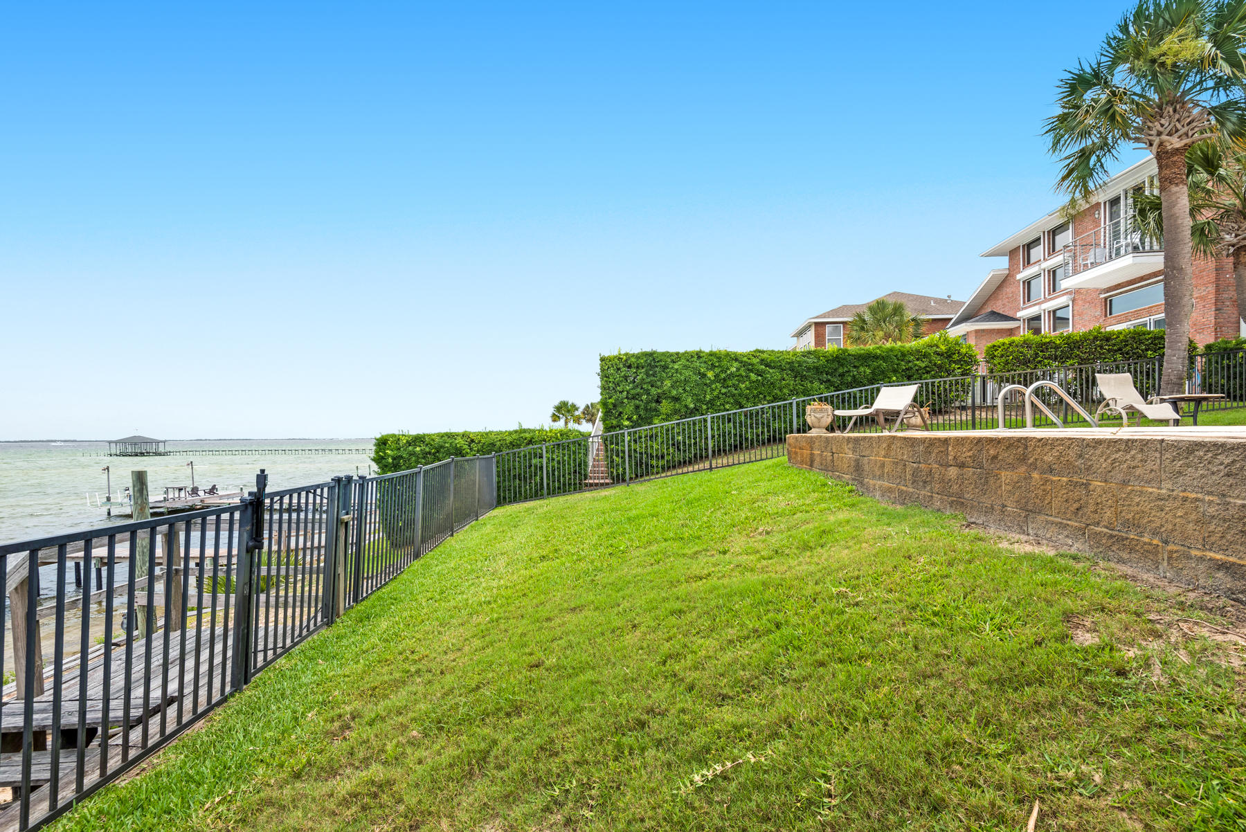 311 Country Club Road Shalimar, FL 32579 - Photo 68 of 73 a view of a terrace with a garden
