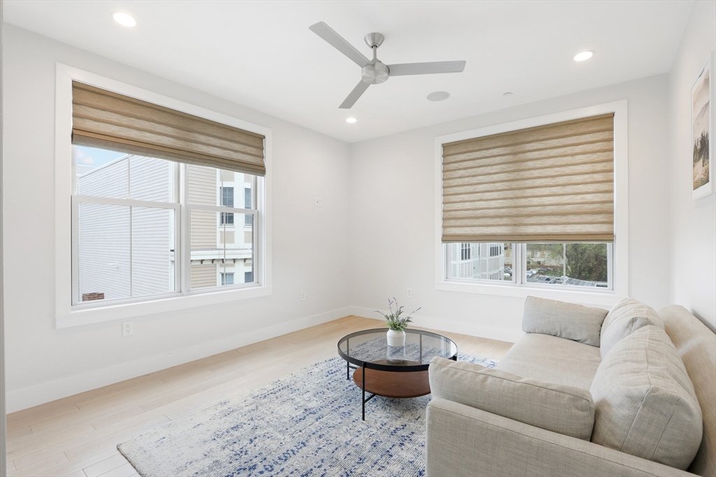 309 E Street, Unit 45 Boston, MA 02127 - Photo 15 of 33 a living room with furniture and a large window