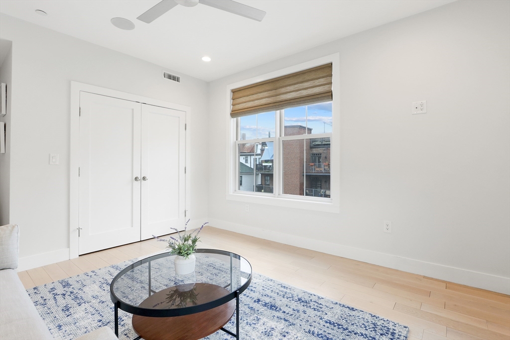 309 E Street, Unit 45 Boston, MA 02127 - Photo 17 of 33 a room with furniture and window