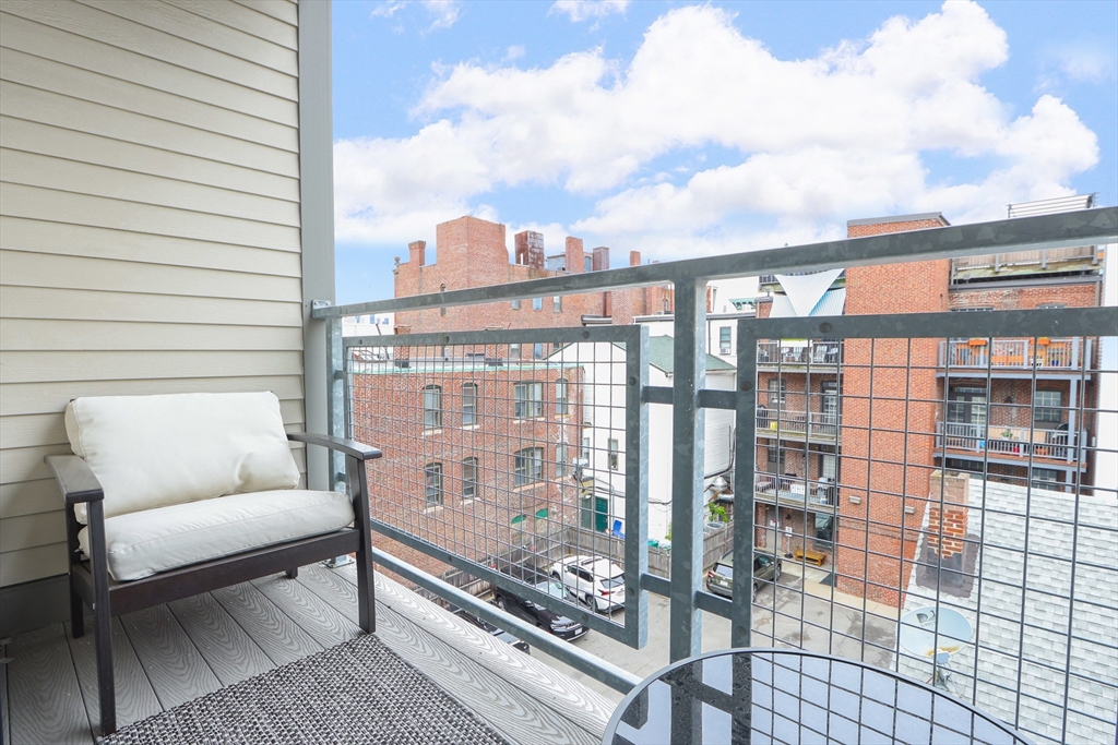 309 E Street, Unit 45 Boston, MA 02127 - Photo 19 of 33 a view of a balcony with furniture