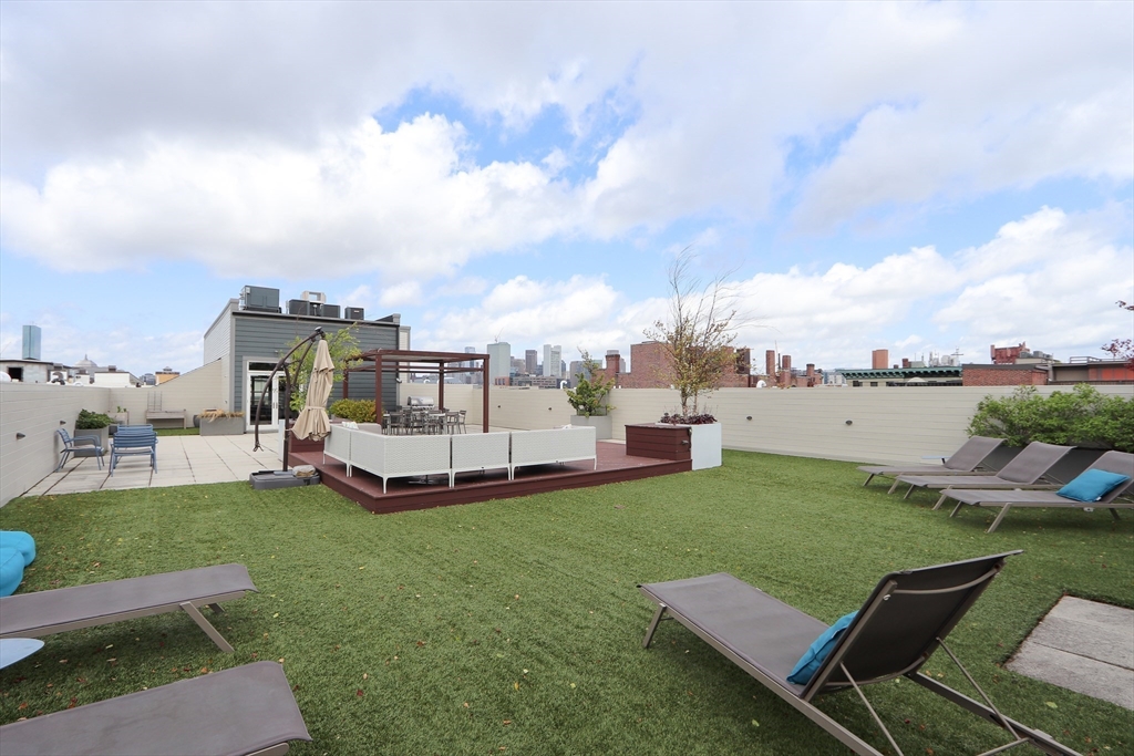 309 E Street, Unit 45 Boston, MA 02127 - Photo 22 of 33 a view of a backyard with sitting area