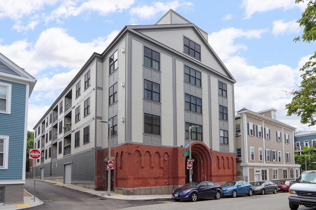 309 E Street, Unit 45 Boston, MA 02127 - Photo 33 of 33 a front view of a building with lot of windows and entryway