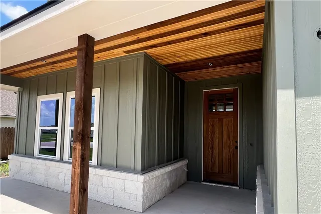 a front view of a house with shower and door