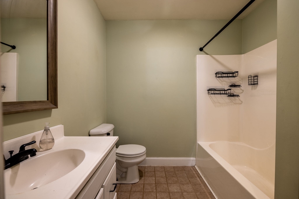 1556 North Main Street, Unit 10 Fall River, MA 02720 - Photo 12 of 30 a bathroom with a sink toilet and shower
