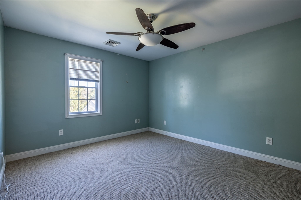 1556 North Main Street, Unit 10 Fall River, MA 02720 - Photo 14 of 30 an empty room with a window and a fan