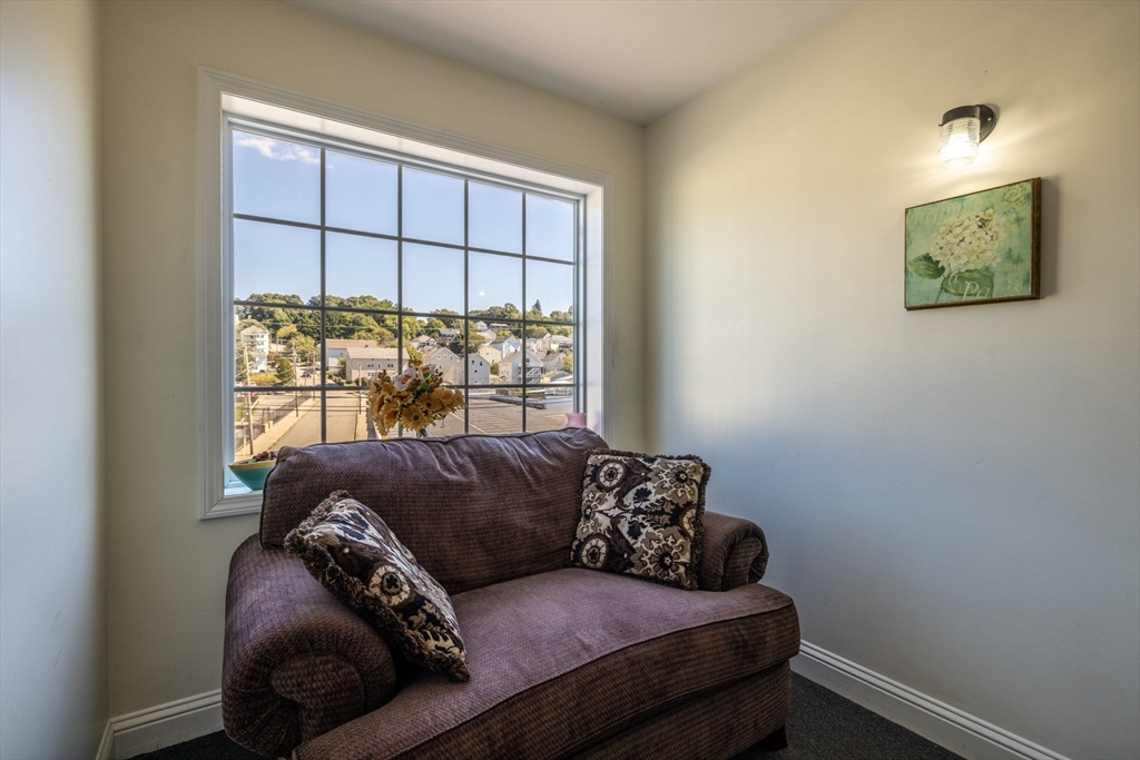 1556 North Main Street, Unit 10 Fall River, MA 02720 - Photo 21 of 30 a living room with a couch and a window