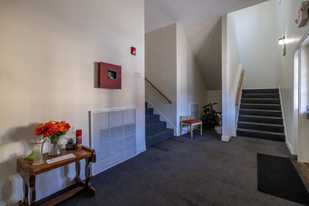 1556 North Main Street, Unit 10 Fall River, MA 02720 - Photo 23 of 30 a living room with furniture and a fireplace