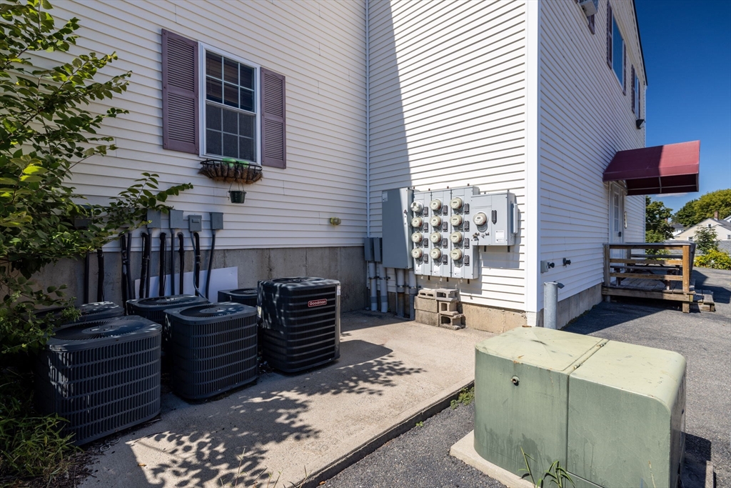 1556 North Main Street, Unit 10 Fall River, MA 02720 - Photo 25 of 30 a view of a patio with chairs and a fire pit