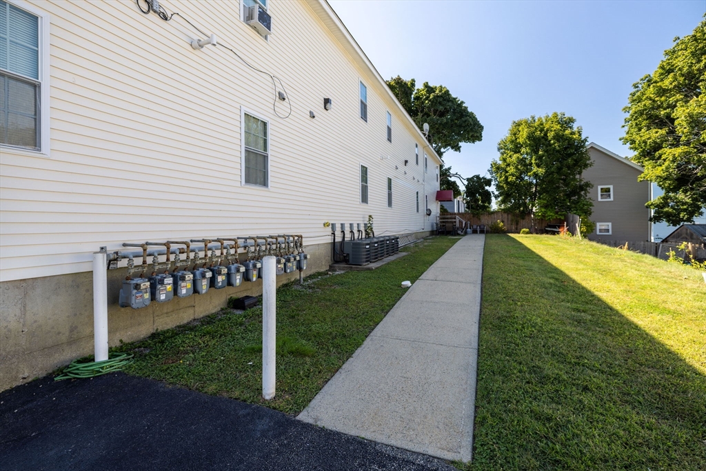 1556 North Main Street, Unit 10 Fall River, MA 02720 - Photo 26 of 30 a view of a house with a yard