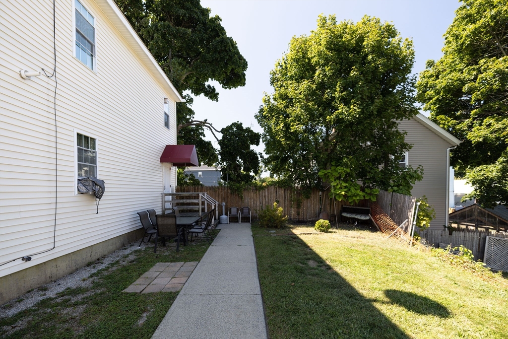 1556 North Main Street, Unit 10 Fall River, MA 02720 - Photo 28 of 30 a front view of a house with a patio
