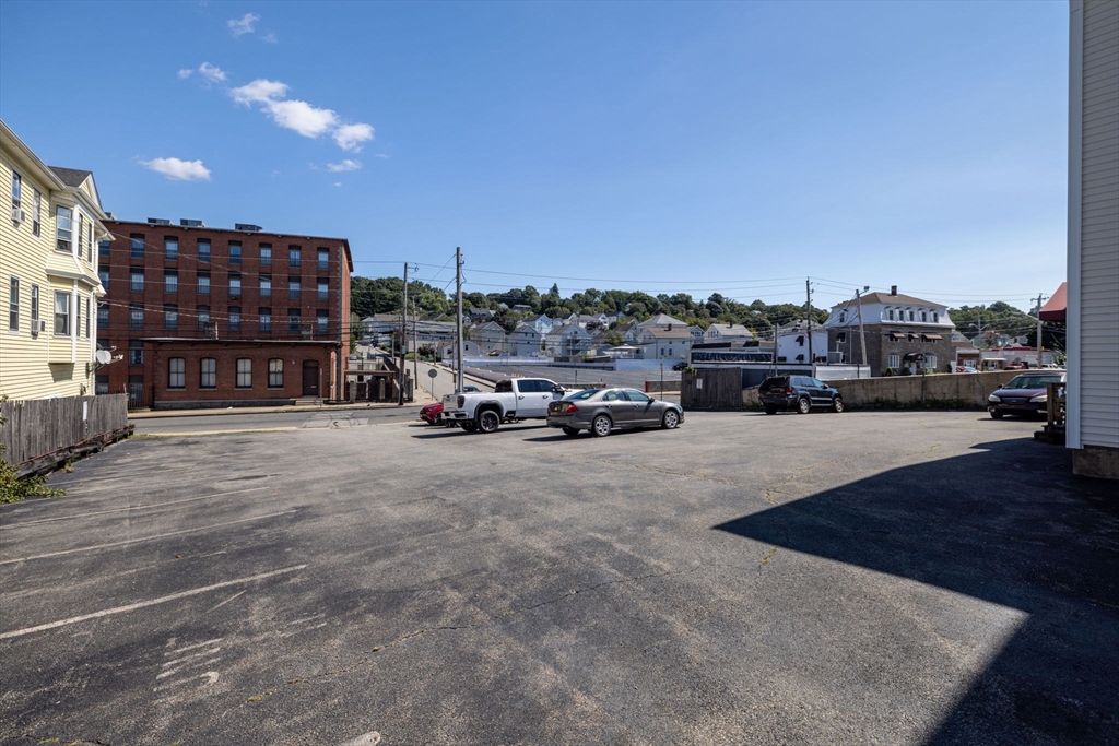 1556 North Main Street, Unit 10 Fall River, MA 02720 - Photo 4 of 30 a car parked on the side of the road