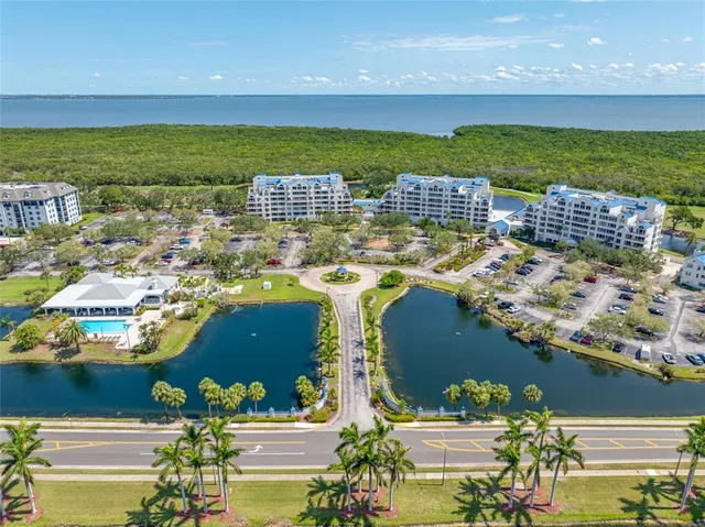 a view of a playground with a garden and trees