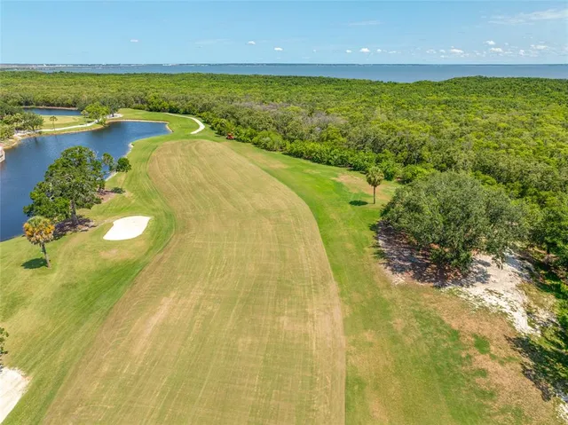 a view of a swimming pool with a lot of residential buildings in ocean view