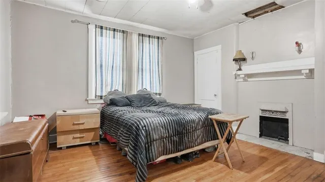 a bedroom with a bed and a table in it