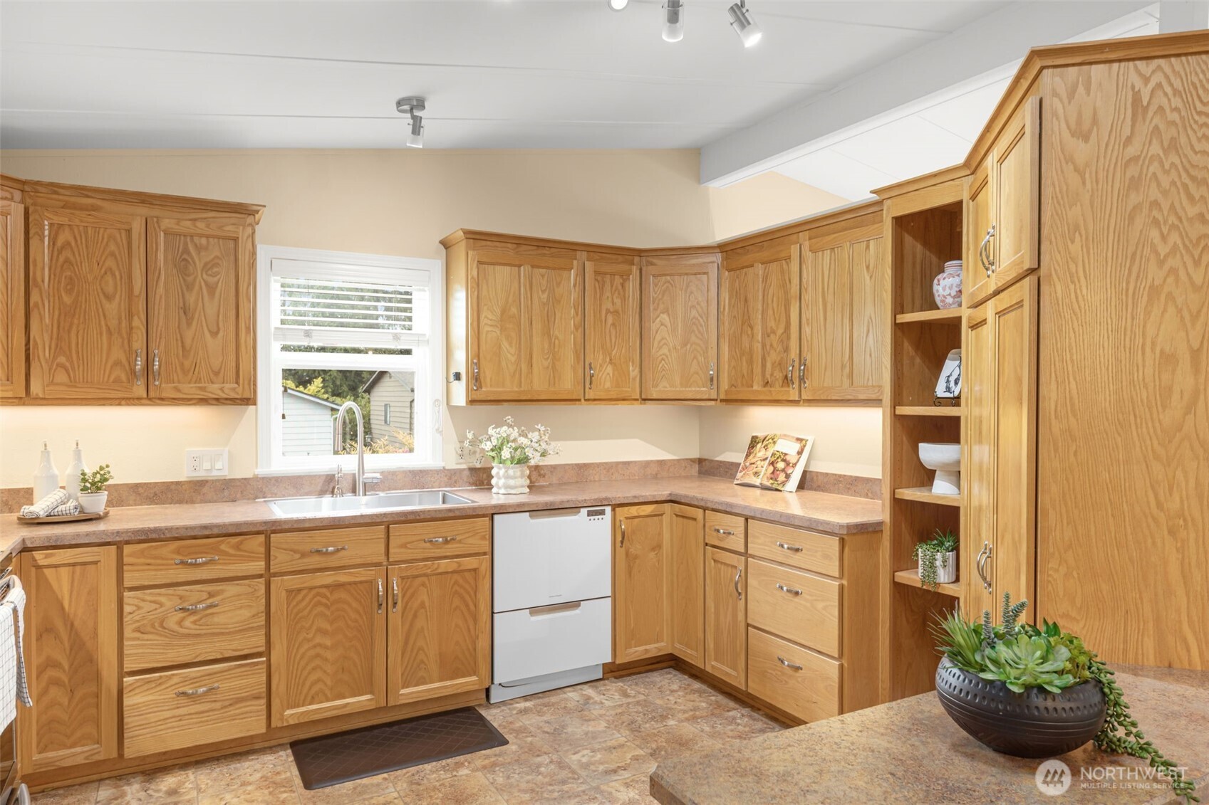 23807 7th Place West Bothell, WA 98021 - Photo 11 of 26 a kitchen with a sink and cabinets
