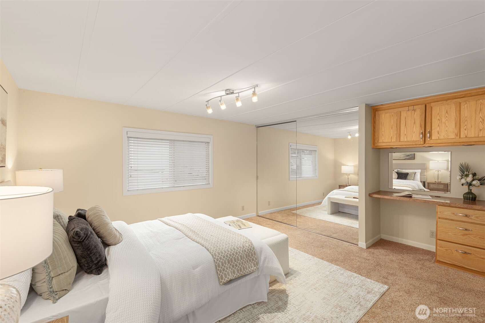 23807 7th Place West Bothell, WA 98021 - Photo 13 of 26 a bedroom with a bed and a chandelier