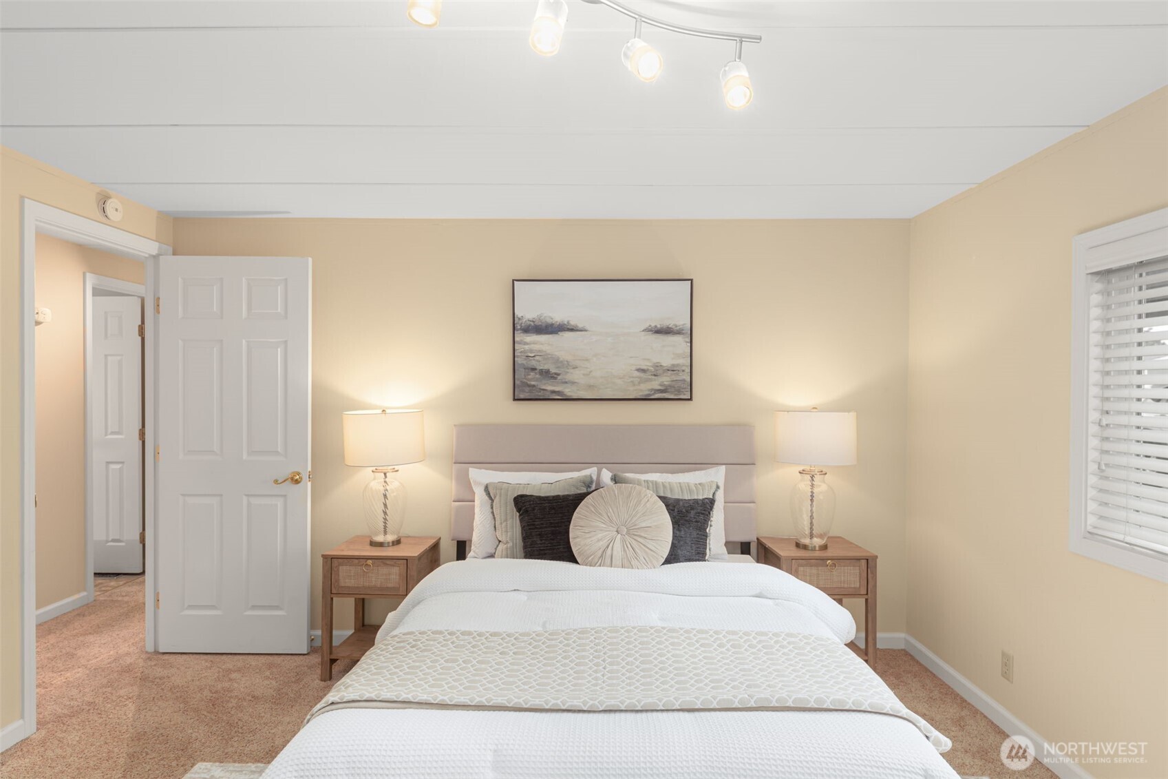 23807 7th Place West Bothell, WA 98021 - Photo 14 of 26 a spacious bedroom with a bed and painting on the wall