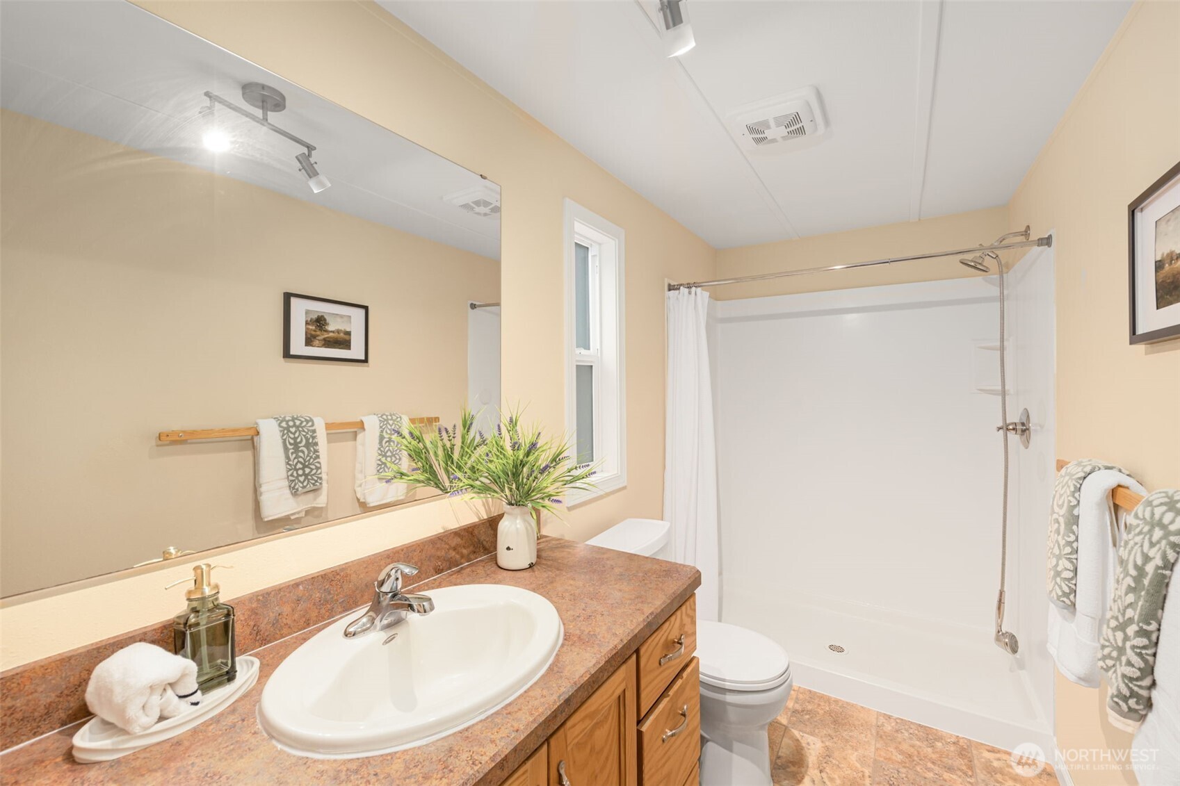 23807 7th Place West Bothell, WA 98021 - Photo 15 of 26 a bathroom with a granite countertop sink a toilet and a mirror
