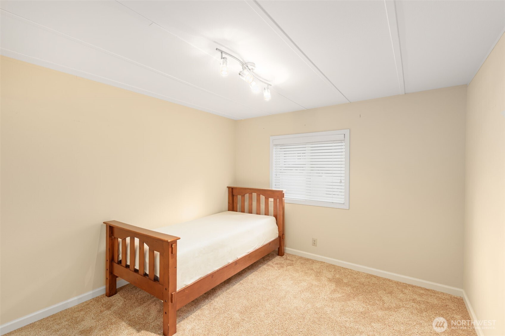 23807 7th Place West Bothell, WA 98021 - Photo 16 of 26 a bedroom with a bed and a window