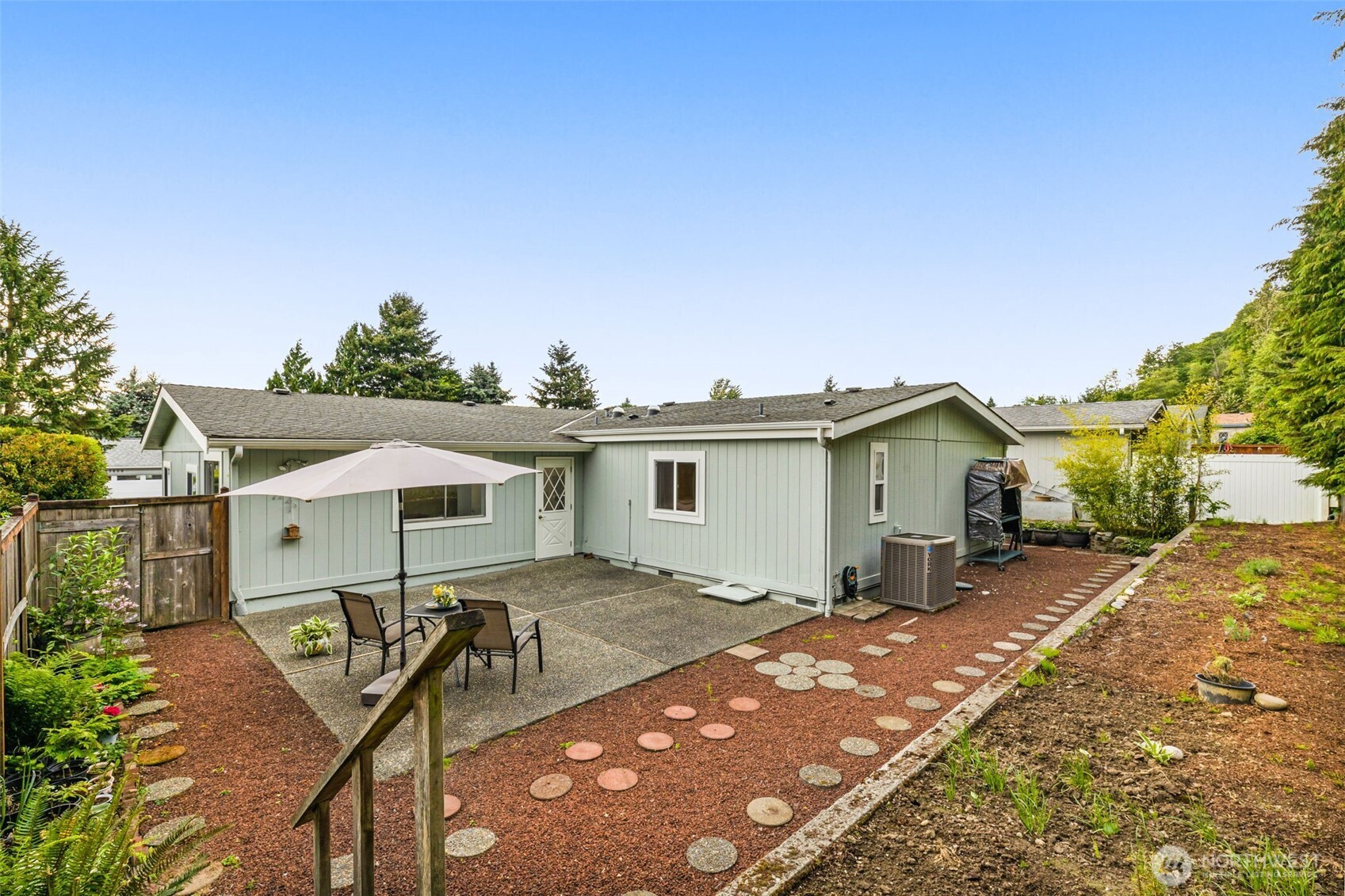 23807 7th Place West Bothell, WA 98021 - Photo 21 of 26 a view of a house with backyard and furniture