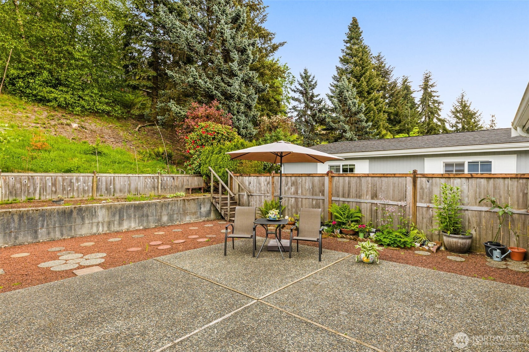 23807 7th Place West Bothell, WA 98021 - Photo 23 of 26 a backyard of a house with table and chairs