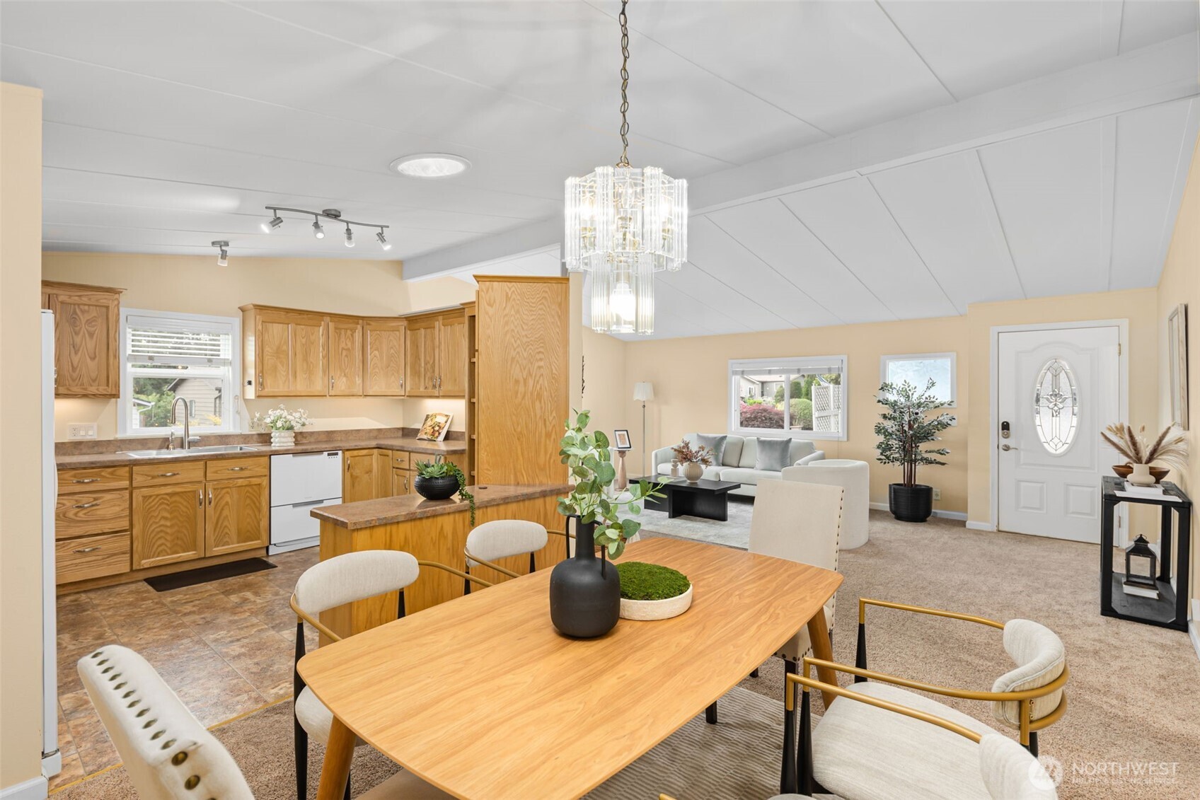 23807 7th Place West Bothell, WA 98021 - Photo 7 of 26 a very nice looking dining room with kitchen island furniture a chandelier a large window and kitchen view