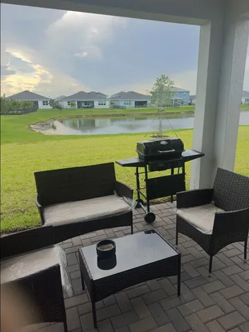 a view of a terrace with outdoor seating