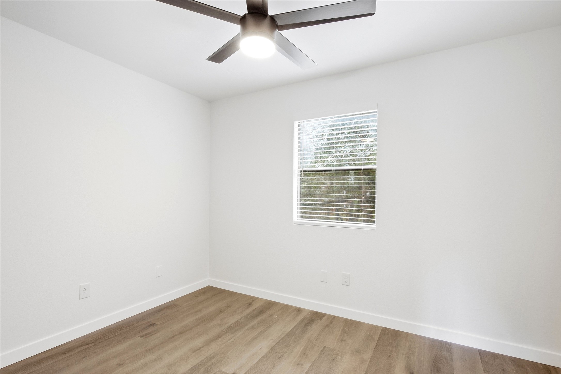 2500 Jones Road, Unit B Austin, TX 78745 - Photo 35 of 37 Natural light fills this versatile space highlighting the smooth wood flooring.