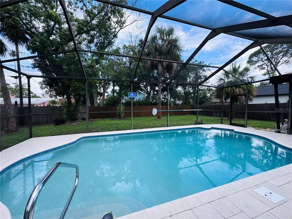 a view of a swimming pool with a patio