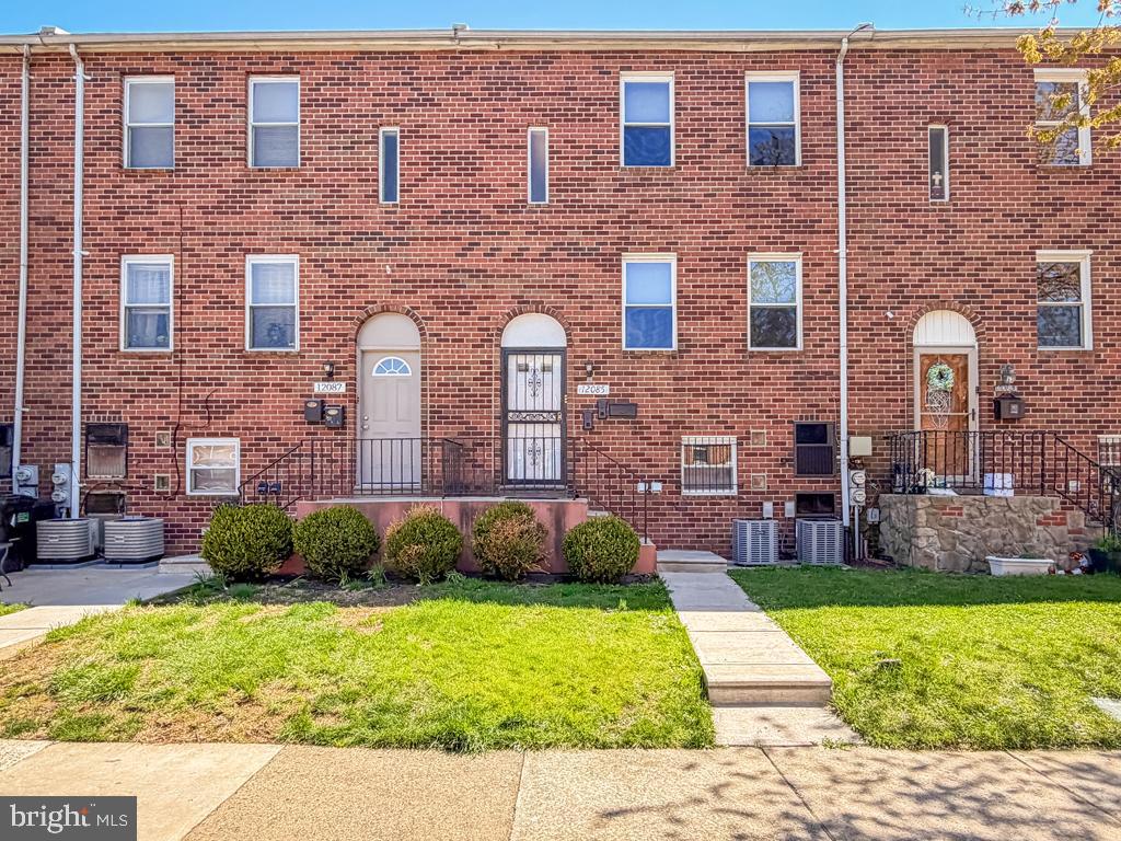 a brick building with a yard