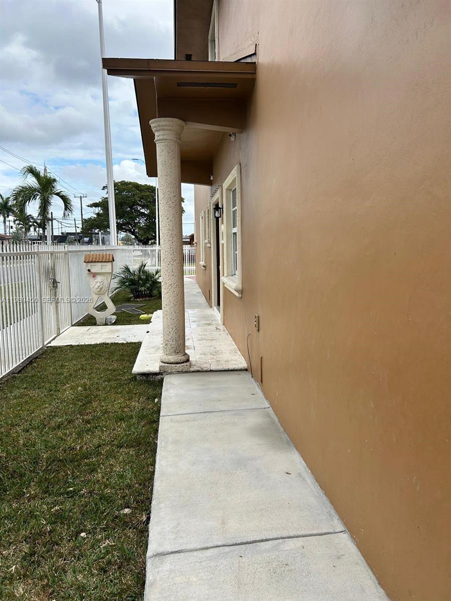 948 East 47th Street, Unit 948A Hialeah, FL 33013 - Photo 14 of 14 a view of a patio with table and chairs a barbeque
